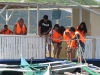 Ready to Sail – Tourists Preparing for a Catamaran Adventure